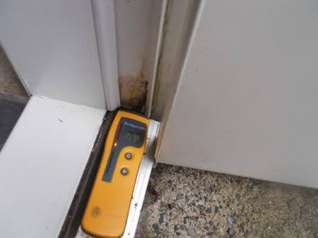 shows exposed south-facing door that swings out and has interior hinges to the weather. Water has been leaking around the hinges and will eventually rot the jamb and edge of the door. This door was just two years old. 