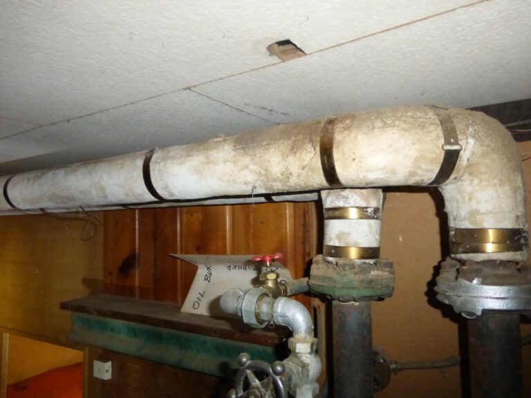 Open piping in an older house. Use as an example for home inspector training