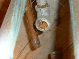 Dylan Chalk photo of steel water pipe occluded with rust