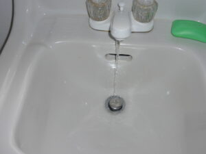 Dylan Chalk photo of water running in sink